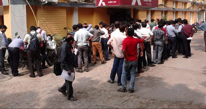 Latest news on Bhutan | ThePrint.in Bhutan - People standing in queue outside ATM