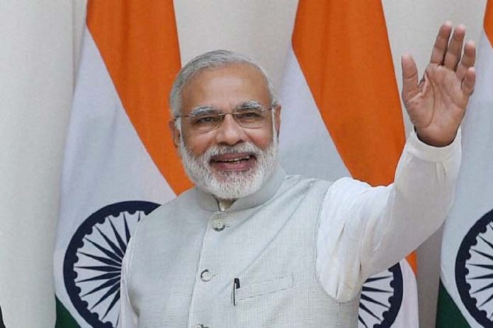 Modi waving at the audience
