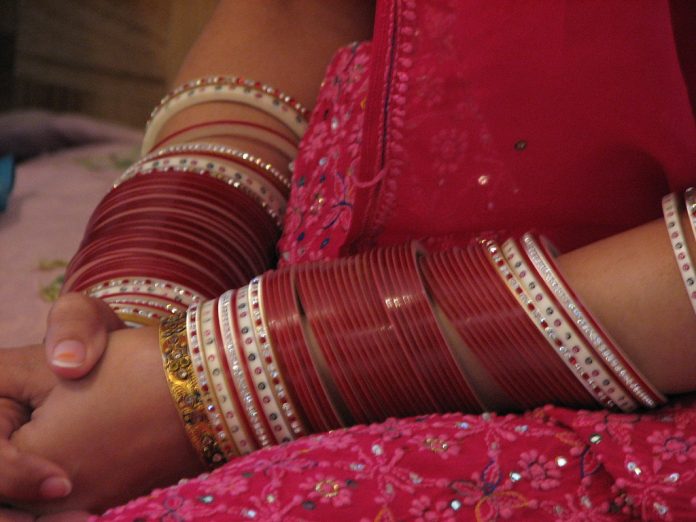 Latest news on child marriage | SC order can be harmful | theprint.in A woman's hand with bangles