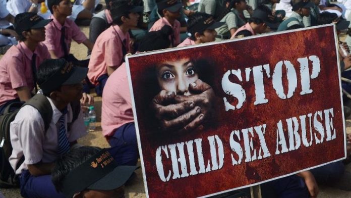 Schoolchildren participating in an awareness campaign against child sex abuse