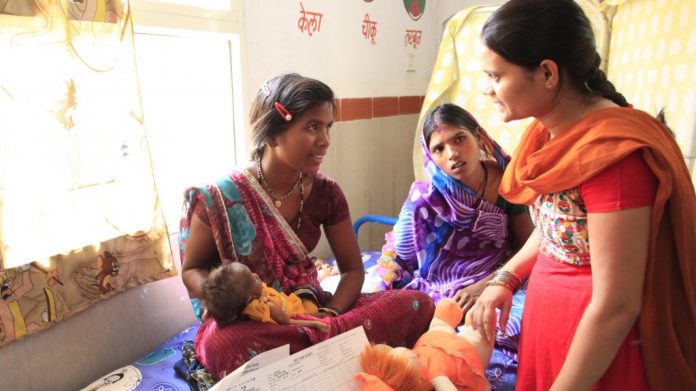 Latest news on maternal healthcare | ThePrint.in A Midwife speaks to young mother at a hospital | PTI