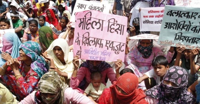Latest News on patriarchy in Haryana | ThePrint Women sitting in protest with written slogans to stop crime against