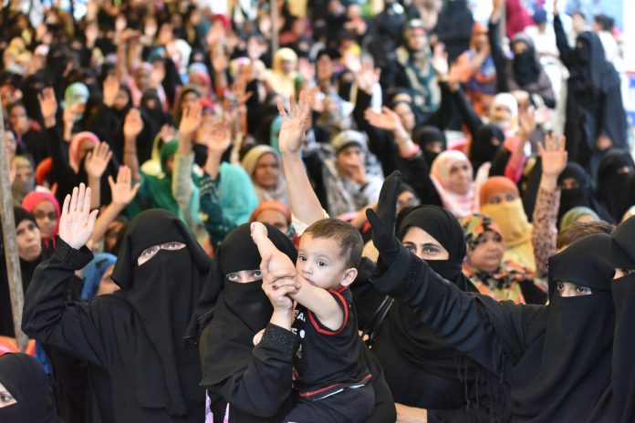 Latest news on triple talaq| ThePrint muslim women holding a babt, celebrating the triple talaq bill