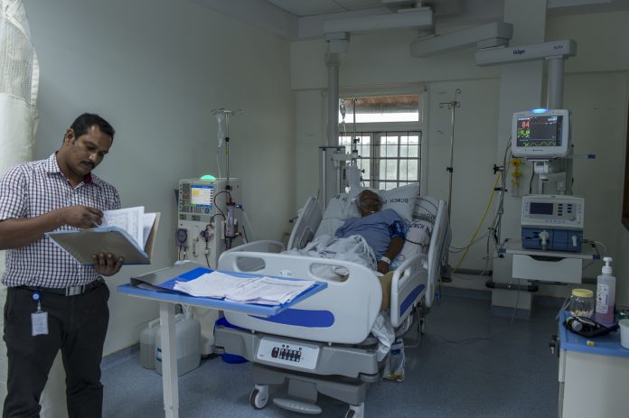 Latest news on Kerala | Health report | ThePrint.in A hospital staff reviewing medical charts of a patient in a hospital