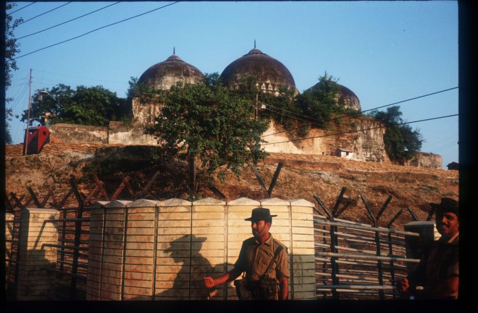Latest news on Ayodhya Dispute | ThePrint.in A member of the border security force guards the Babri Masjid |Robert Nickelsberg/Liaison