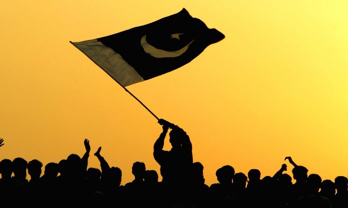 Latest news on Go to Pakistan | ThePrint A man waves the flag of Pakistan