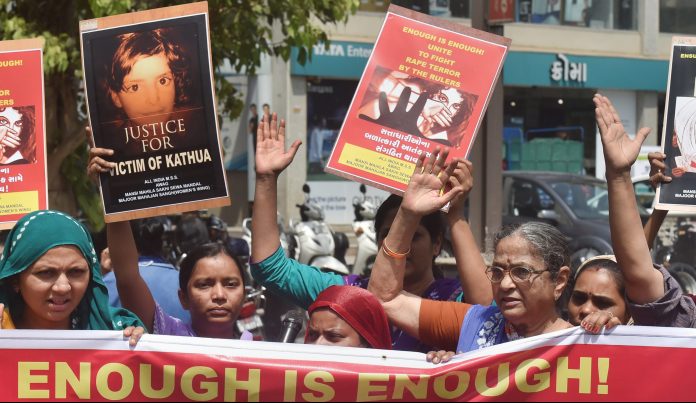 Latest news on Kathua rape-murder | theprint.in People display placards as they protest over government's alleged 'inaction' in Kathua and Unnao rape cases | PTI