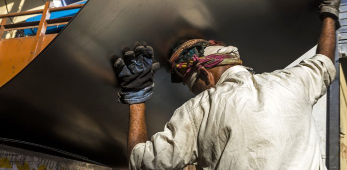Latest news on Economy | Theprint.in A workers loads a steel sheet onto a truck in the Naraina steel and iron market area of New Delhi, India