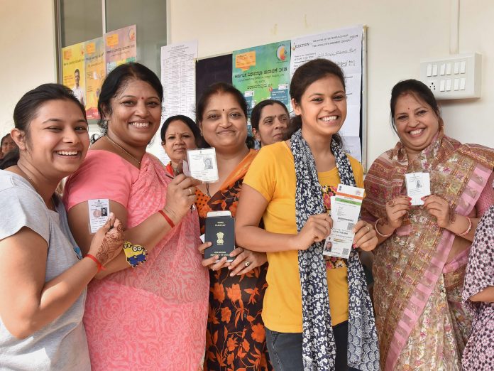 Latest news on Karnataka elections | Theprint.in Voters show their voting ID as they cast their vote for Karnataka Assembly elections in Hubballi on Saturday