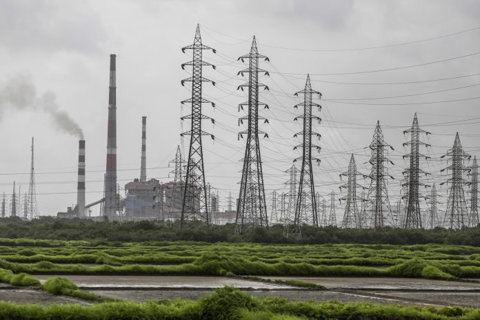 Latest news on TATA | Theprint.in Smoke rises from a chimney as electricity pylons stand at the Tata Power Co. Trombay Thermal Power Station