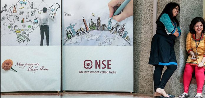 Latest news on NSE | Opinion | ThePrint.in Employees stand next to an advertisement for the National Stock Exchange (NSE) during a break at the bourse in Mumbai
