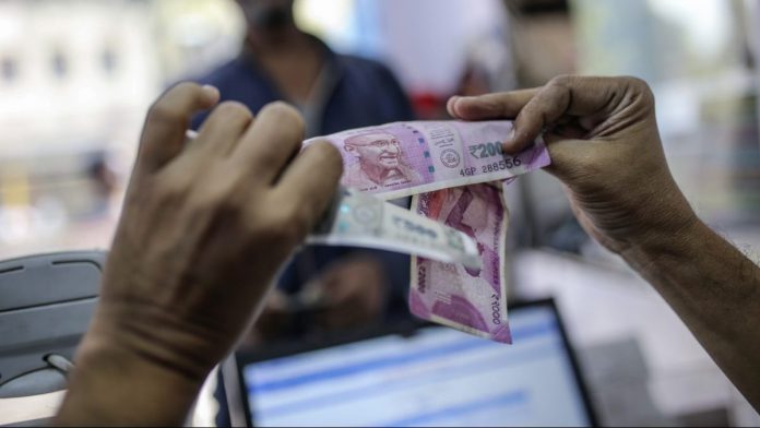 Latest news on Indian banks | Economy | ThePrint.in A cashier examines Indian rupee banknotes at the Mayuresh Watches and Traders watch and mobile phone store in the Byculla area of Mumbai