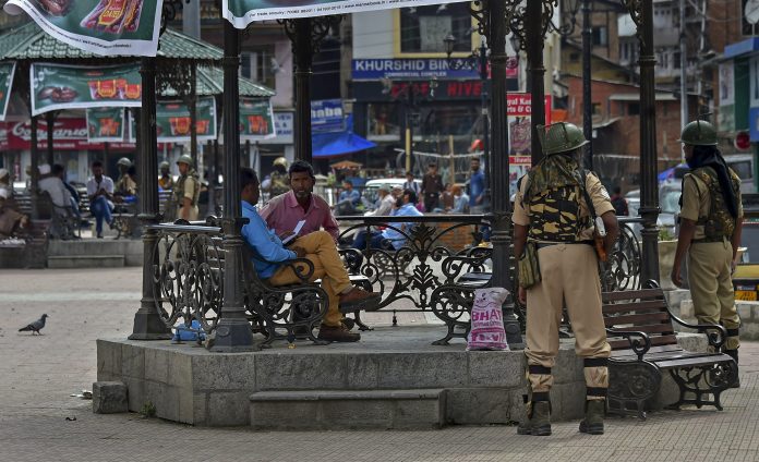 Latest news on Kashmir Security personnel stand guard at Lal Chowk in Srinaga