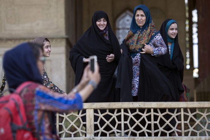 Latest on Global Pulse| ThePrint.in Iranian women watch as a girl clicks selfie at the Chehel Sotun palace in Isfahan, Iran