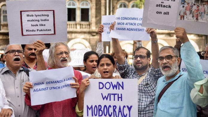Latest news on Protest against mob lynching| ThePrint.in Documentary filmmaker Anand Patwardhan with other activists raise slogans to condemn mob lynching| PTI