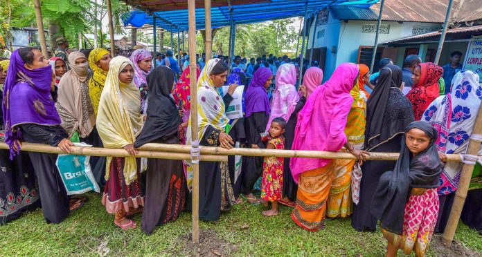 Latest news on NRC | theprint.in People wait to check their names on the final draft of the NRC in Nagaon | PTI