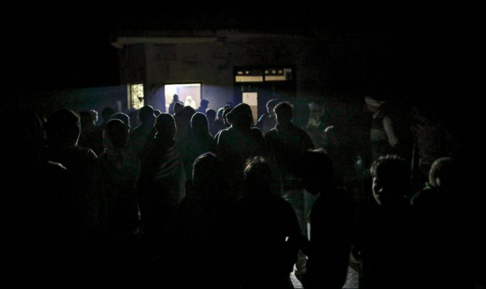 Latest news on Saubhagya scheme | theprint.in People gather outside a dairy shop in Fateh Nagla, Uttar Pradesh | Prashanth Vishwanathan/Bloomberg
