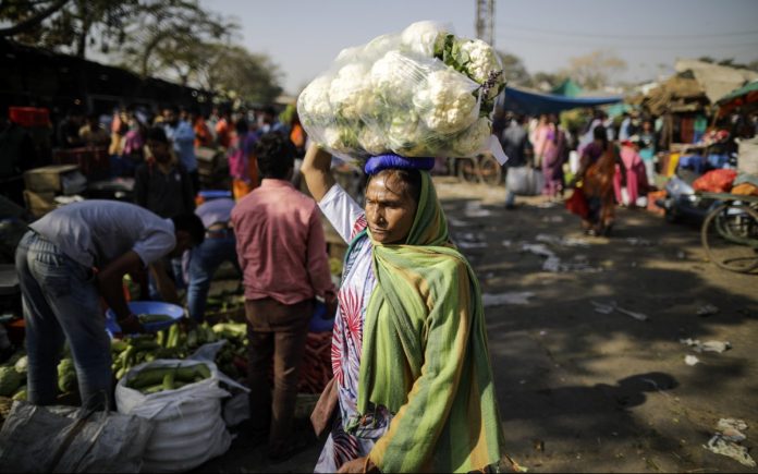 Latest news on GDP | ThePrint.in A woman at a vegetable market in Udaipur | Prashanth Vishwanathan/Bloomberg