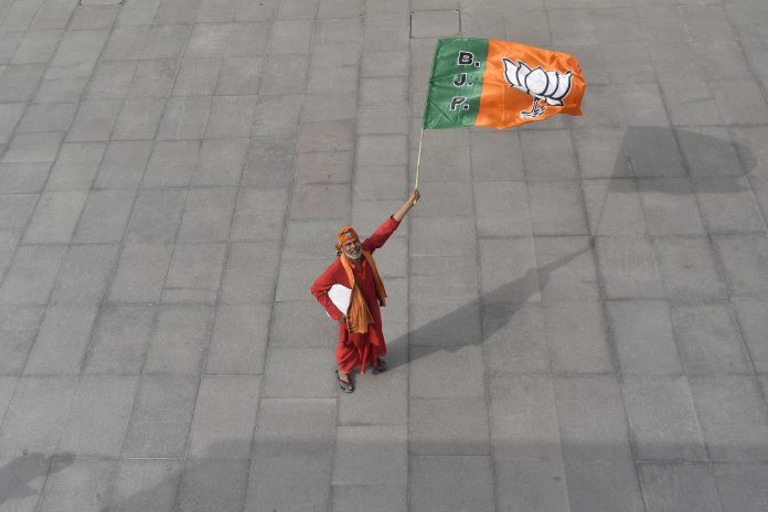 Latest news on BJP | theprint.in A man holds a flag of Bharatiya Janata Party at the courtyard of the party's headquarters in New Delhi (REPRESENTATIONAL IMAGE) | Anindito Mukherjee/Bloomberg