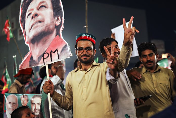 Pakistan's Opposition Leader Imran Khan Holds Campaign Rally Ahead of Elections Supporters of Imran Khan, chairman of Pakistan Tehreek-e-Insaf | Asad Zaidi/Bloomberg