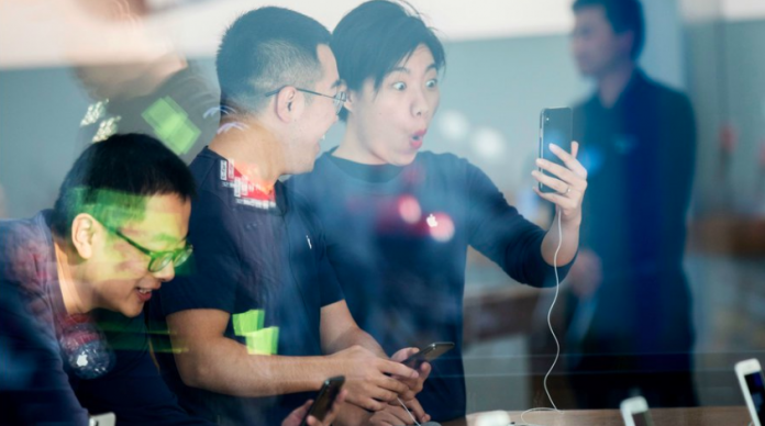 Latest news on China | ThePrint.in Chinese customers look at the new iPhone X at an Apple store | Getty images