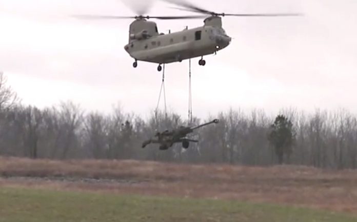 M777-Howitzer An M777 Ultra Light Howitzer underslung from a Chinook helicopter | YouTube