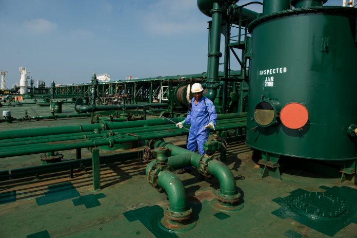 Latest news on economy | ThePrint.in A crew man works on the deck of an oil tanker (Representational image) | Bloomberg