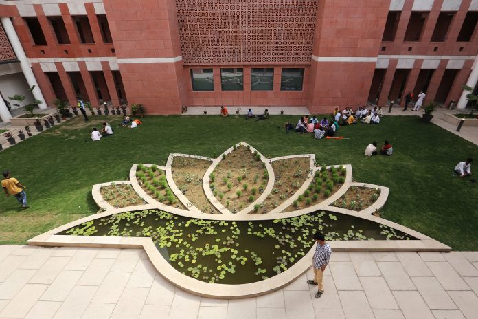 A garden feature shaped like a lotus, the emblem of the the Bharatiya Janata Party (BJP), is seen in the courtyard of the party's headquarters in New Delhi, India, on Tuesday, May 15, 2018. While the BJP has already moved into its newly-built, swanky, high-walled headquarters in New Delhi, the new office of the Congress party is still under construction due to a lack of funds, said the party leader. Congress earned one-fourth of the funds than BJP in the financial year ended March 2017. Photographer: Anindito Mukherjee/Bloomberg