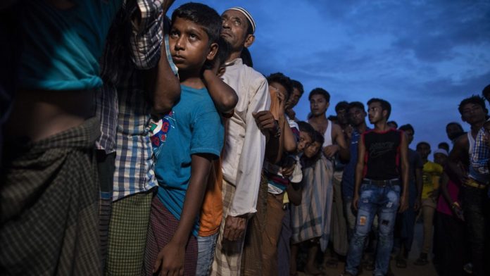 Latest news on Rohingya Muslims | ThePrint.in Rohingya refugees wait in line for humanitarian aid in Kutupalong camp | Paula Bronstein/Getty Images