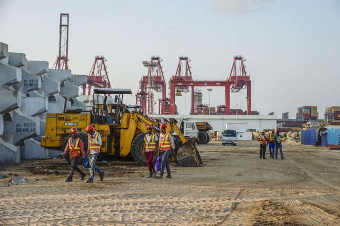 Latest News on South Asia | ThePrint.in Workers walk past excavators at the site of Colombo Port City, developed by China Harbour Engineering Co