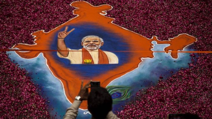 Latest news on Modi and upper caste voters | theprint.in A map of India made with flowers and Narendra Modi's image, Ahmedabad | Kevin Frayer/Getty Images)