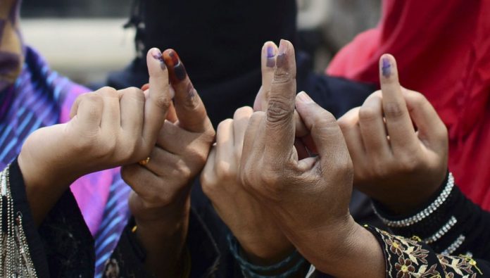 Latest news on Muslim voters | ThePrint.in Muslim women show their ink stained finger after casting their vote | Sheeraz Rizvi/Hindustan Times via Getty Images