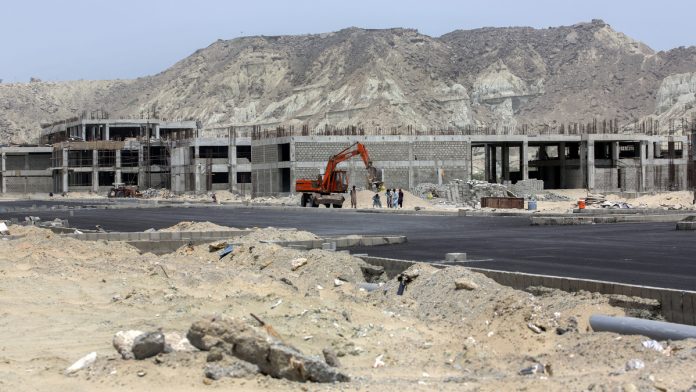 Latest news on China-Pakistan | ThePrint.in Buildings stand under construction at a development site, operated by China Overseas Ports Holding Co., near Gwadar Port in Gwadar, Balochistan, Pakistan | Photographer: Asim Hafeez/Bloomberg