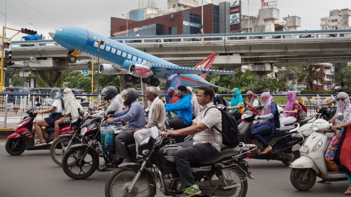 Latest news on Economic growth | ThePrint Motorcyclists ride past a model aircraft displayed between highways in Surat, Gujarat | Karen Dias/Bloomberg