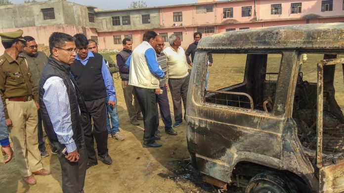 Latest news on Bulandshahr violence | ThePrint Policemen inspect vehicles set on fire by a mob during a protest in Bulandshahr | PTI