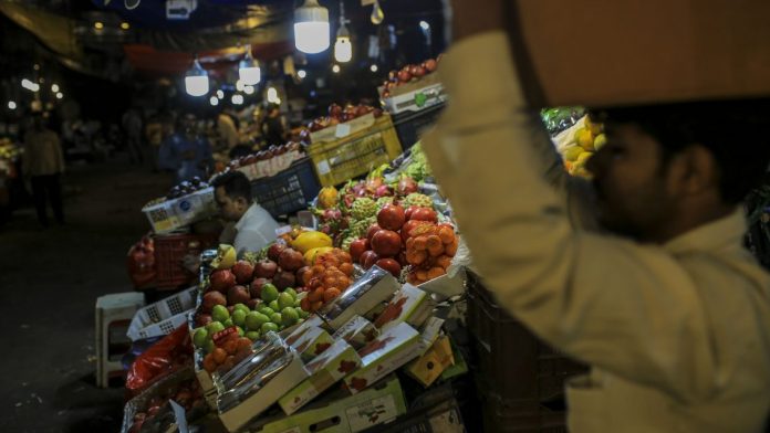 Latest news on Economy | ThePrint A vendor sits at a fruit stall at Crawford Market in Mumbai (Representational image)