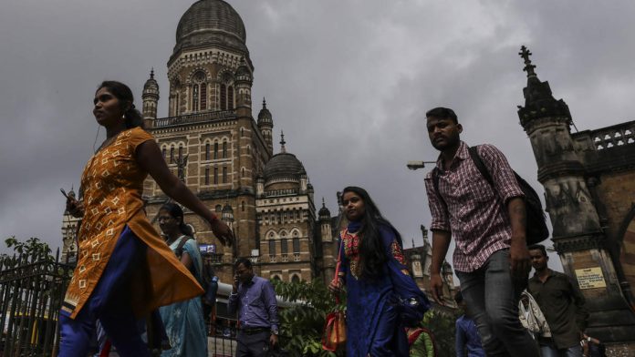 Latest news on Economy | ThePrint Commuters and pedestrians walk past the Chhatrapati Shivaji Terminus railway station in Mumbai (Representational image)