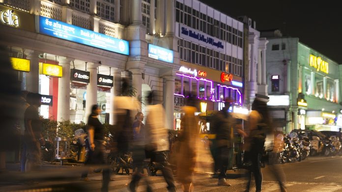 General Economy Ahead of GDP Figure Estimates Pedestrians cross a road at Connaught Place in New Delhi (representational image) | Ruhani Kaur/Bloomberg