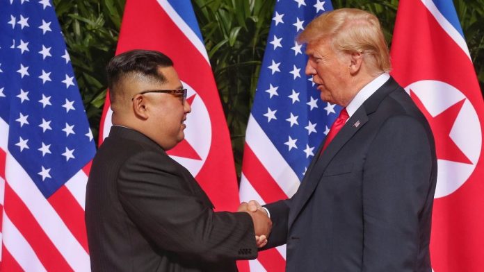 File image of Kim Jong-Un with Donald Trump
