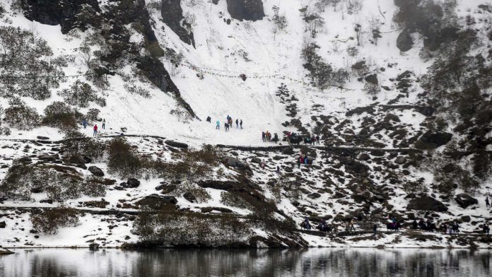 Latest news on Himalayas | ThePrint People gather on a mountain at Tsongmo Lake near to the Nathula Pass, an open trading post in the Himalayas between India and China