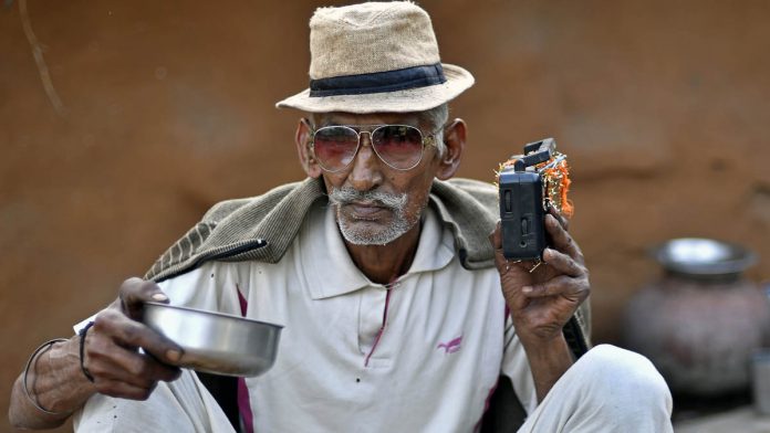 Latest news on radio propaganda | ThePrint A man listens to the radio at a home in Rajasthan