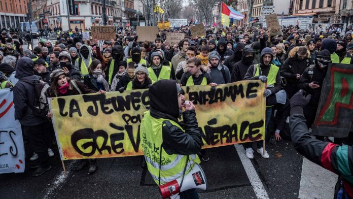 Latest news on Yellow vest protests | ThePrint Demonstrators wearing yellow vests (Gilets jaunes) march behind a large banner during a protest in Toulouse, France