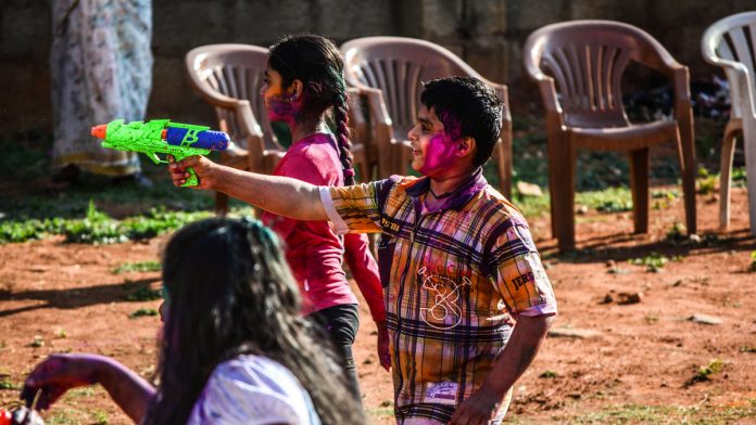 Latest news on World Water Day | ThePrint Kids squit water from a toy gun during Holi | Flickr