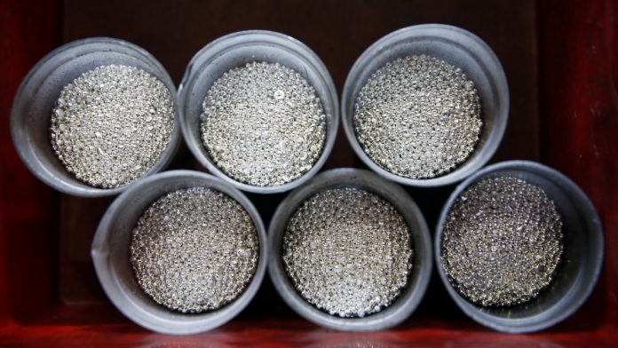 Gold Bar Casting At Valcambi SA Precious Metals Refinery Silver casting grain sits in round holders during the refining process | Stefan Wermuth/Bloomberg
