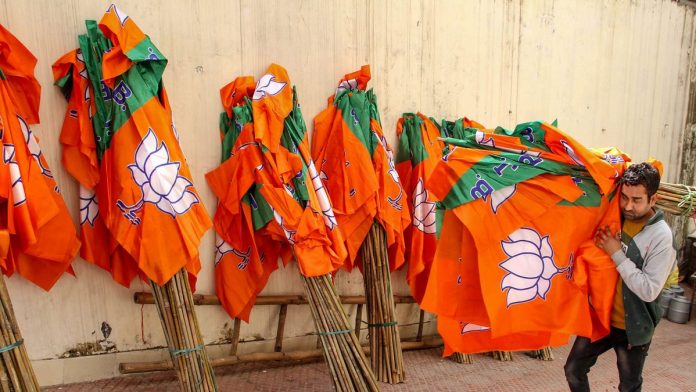 BJP election campaign in Jammu A worker carries Bharatiya Janata Party flags for distribution ahead of an election campaign (representational image) | PTI