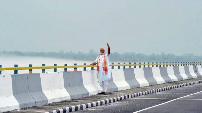 Narendra Modi roads File photo of Narendra Modi at the Dhola Sadia Bridge, across River Brahmaputra, in Assam | PIB