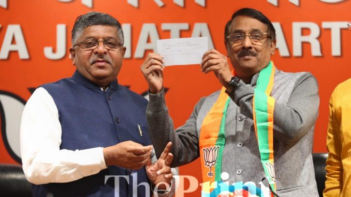 d97494bb-a064-4fd6-a057-26134732522e Tom Vadakkan (right) with union minister Union Minister Ravi (left) Shankar Prasad