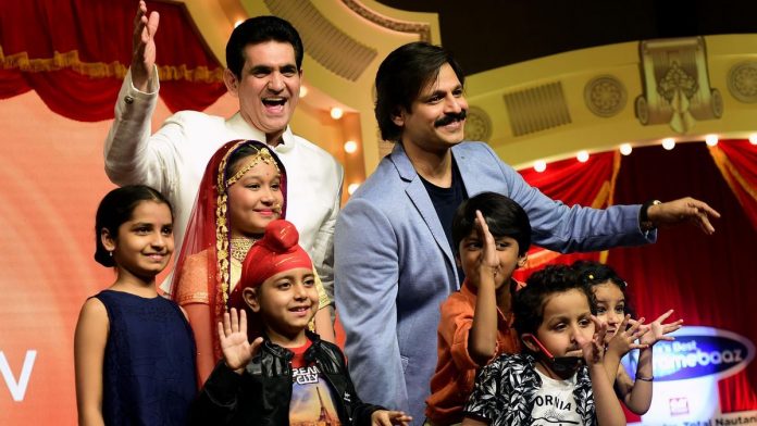 Ambani, Mittal Are Said to Weigh Zee Stake in Fight for Content Actor Vivek Oberoi (R) at the launch of a Zee TV children's show |Sujit Jaiswal/AFP/Getty Images