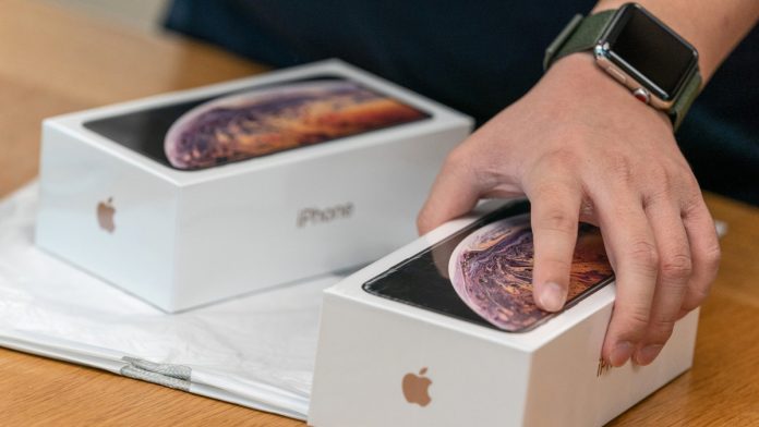 Latest news on iPhone | ThePrint.in An employee holds a box of the Apple Inc. iPhone XS at an Apple store during its launch in Hong Kong, China