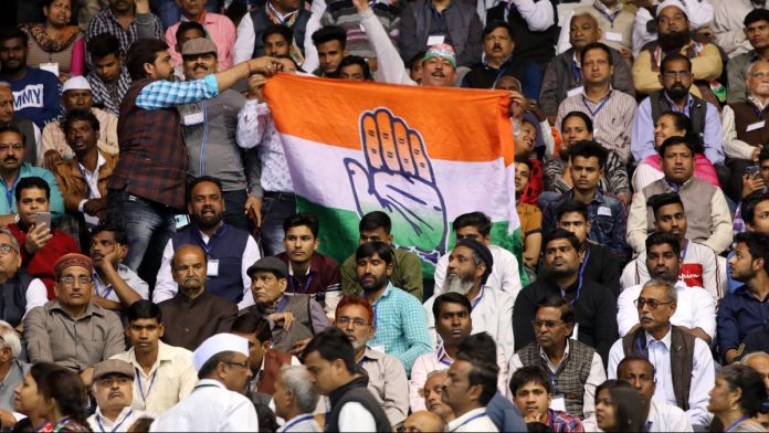 Latest news on Congress and BJP strongholds | theprint.in Attendees hold a Congress banner during an event in New Delhi | T. Narayan/Bloomberg